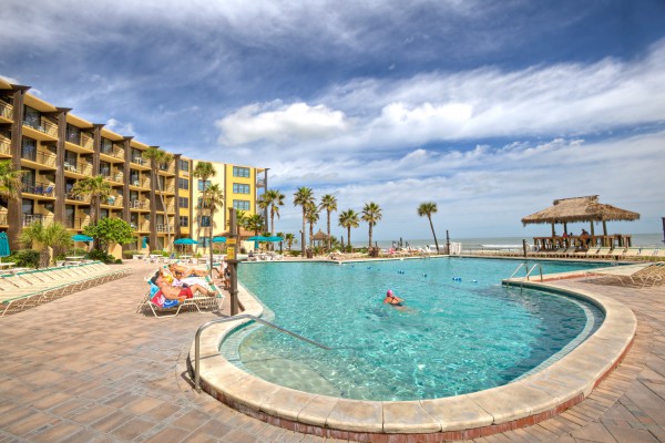 Hawaiian Inn pool with people sunbathing