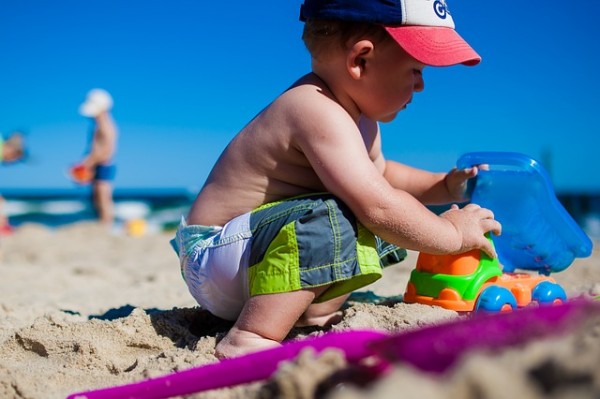 Little boy playing in the sand