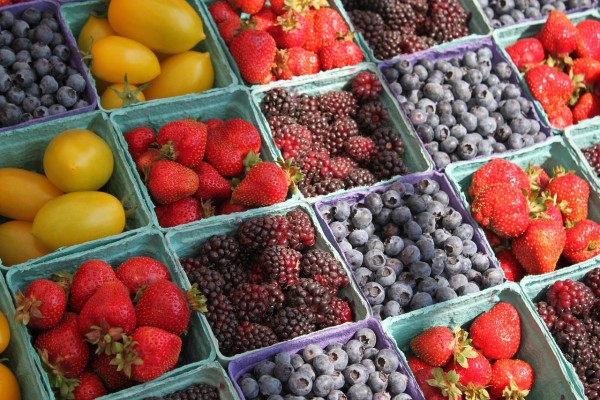 fruits and berries in containers