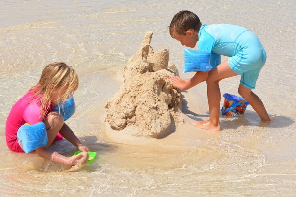 two children building a sandcastle
